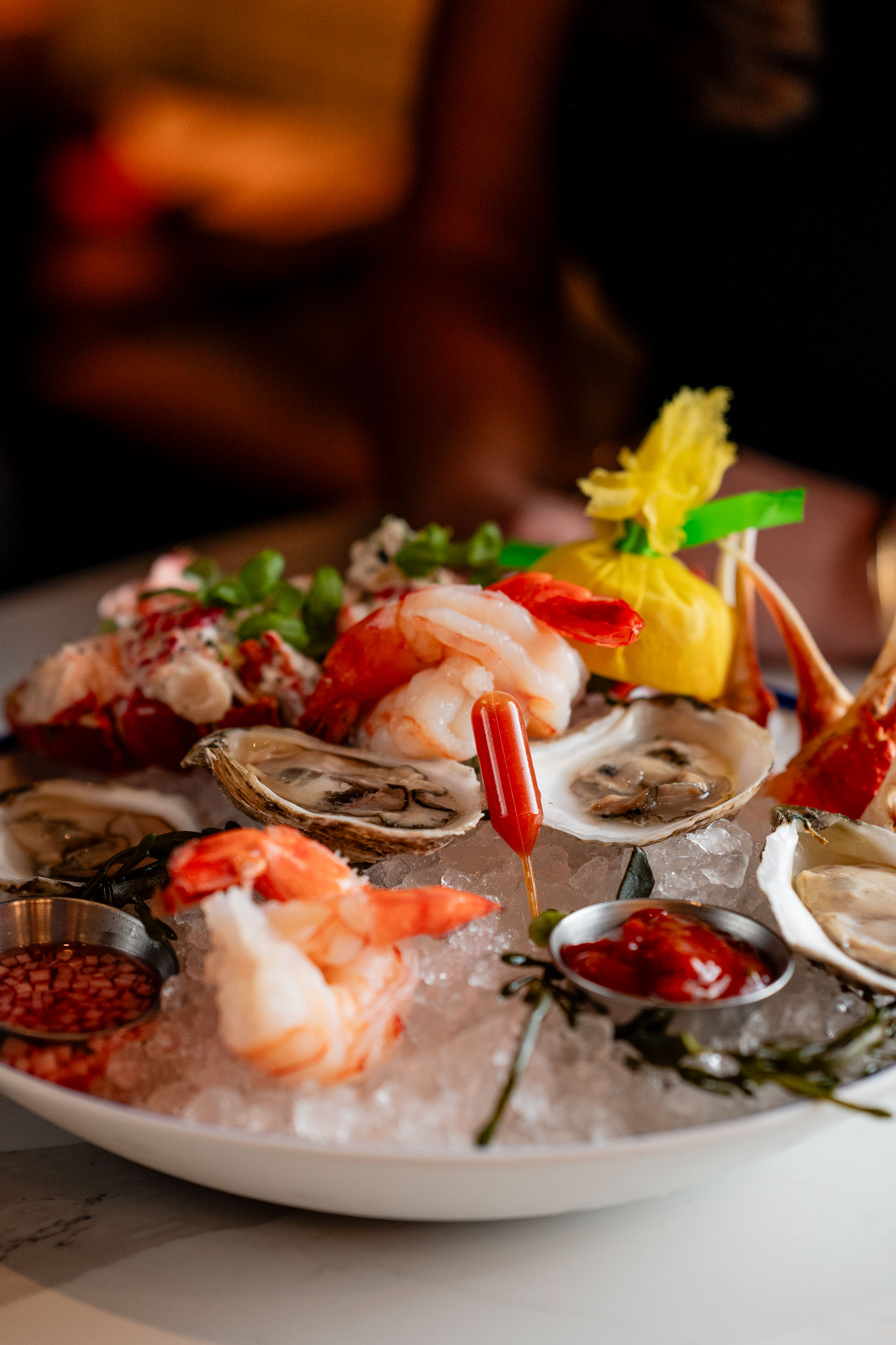 seafood platter consisting of shrimp, lobster, crab claws and oysters